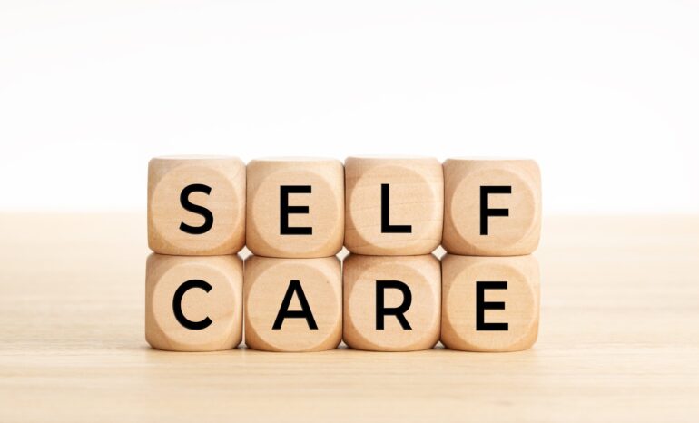 cubes spelling out self care